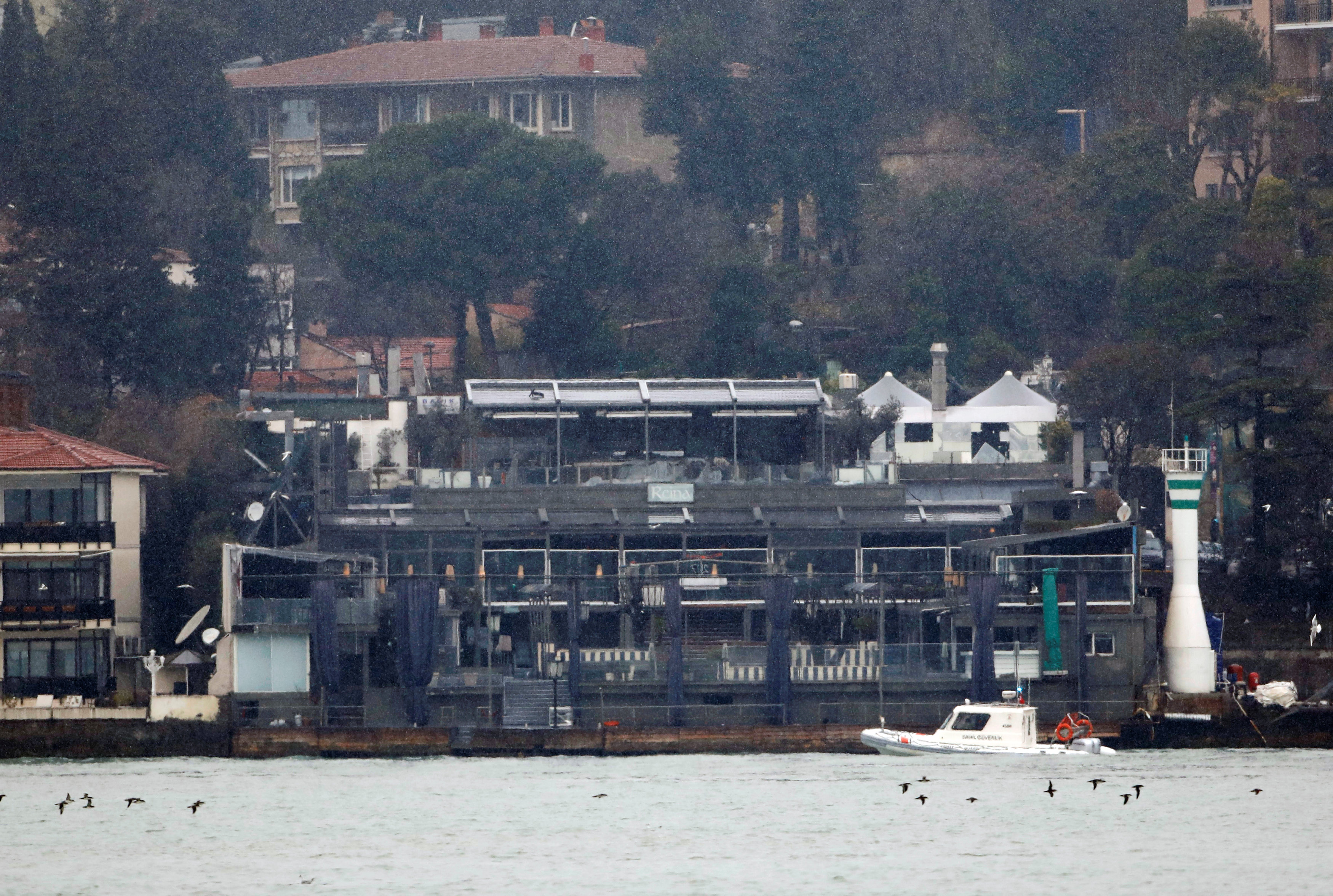 A Turkish coast guard boat patrols in front of the Reina nightclub by the Bosphorus, which was attacked by a gunman, in Istanbul, Turkey, January 1, 2017. REUTERS/Umit Bektas     TPX IMAGES OF THE DAY